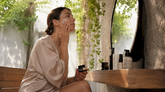 Woman applying daily skin moisturizer