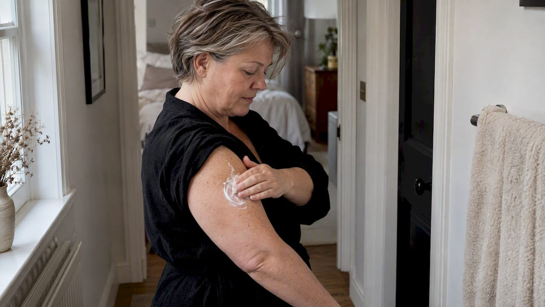 Woman applying body butter to upper arm